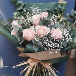 Pink mondial roses, hand tied with gypsophilia and lizianthus